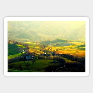 View from top on a hilly landscape with forests in the background Sticker
